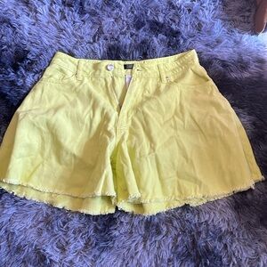 Bright green denim shorts